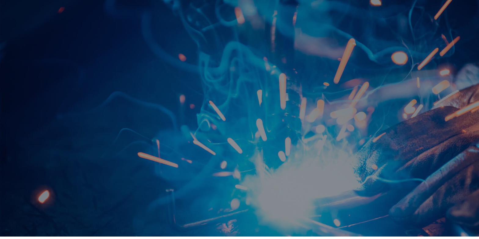 Welding arc and sparks on a fabrication joint